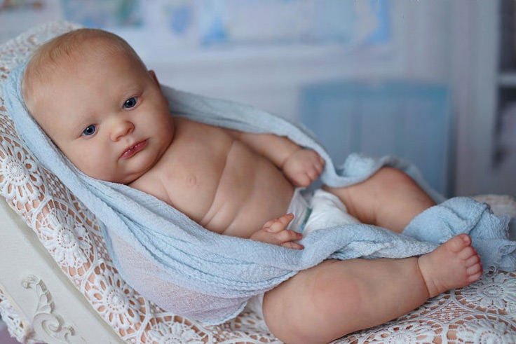 reborn-doll-in-blue Reborn doll care instructions
